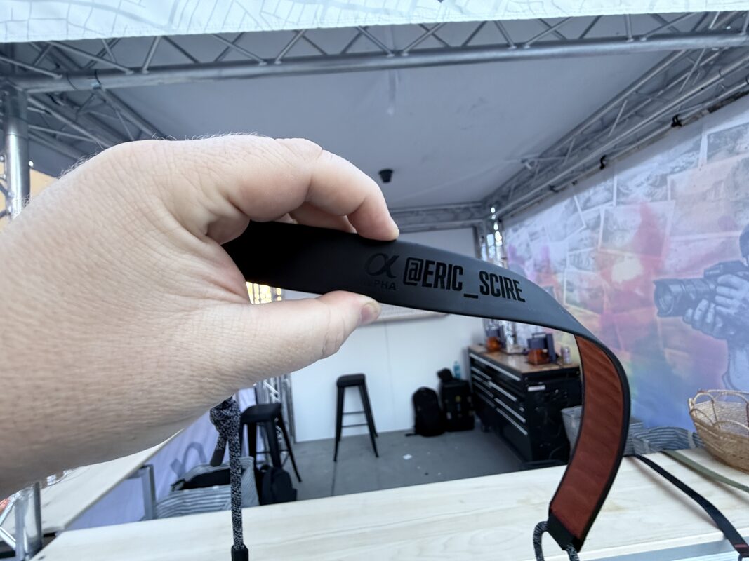 Close-up of a custom printed lanyard strap produced at an outdoor event booth